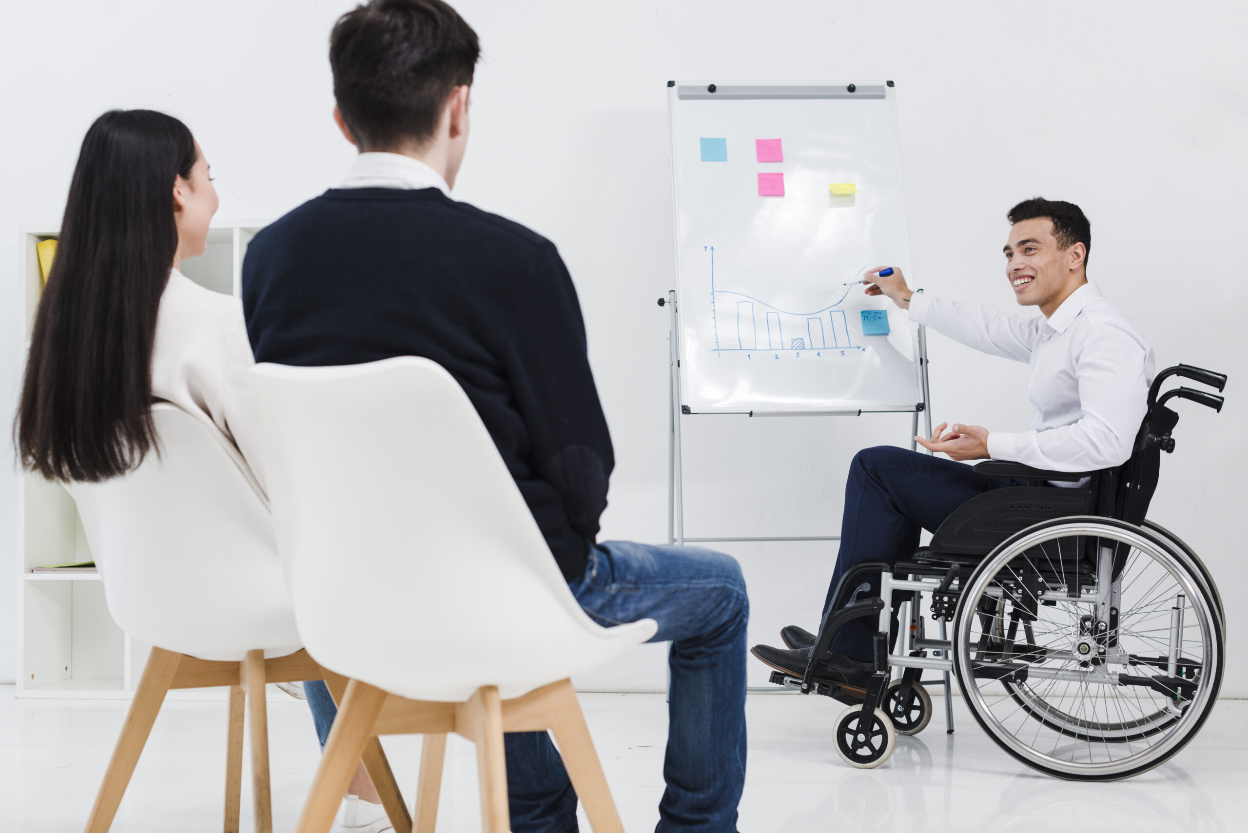 handicapped-young-businessman-giving-presentation-business-colleague